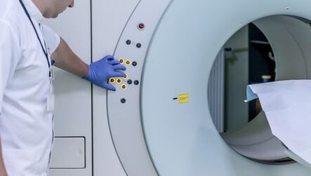 The doctor checks the MRI apparatus